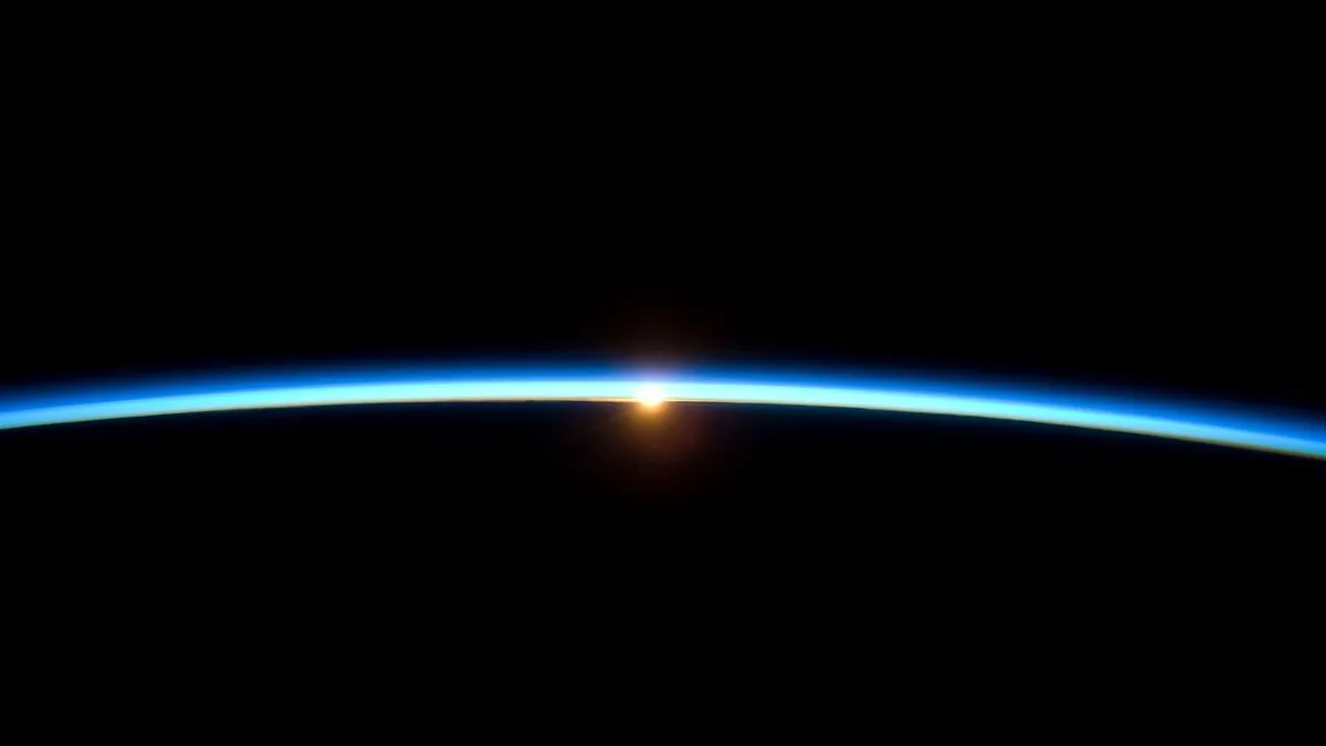 Sunrise over the curve of Earth, representing the global net zero transition